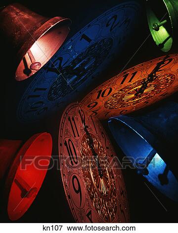 1960s ringing bells and clock faces on the stroke of midnight new years eve View Large Photo Image Stock Photo - 1960s ringing bells and clock faces on the stroke of midnight new years eve. Fotosearch