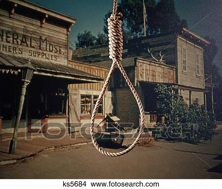 Picture - 1960s rope hangman noose background old west cowboy town lynching justice. Fotosearch