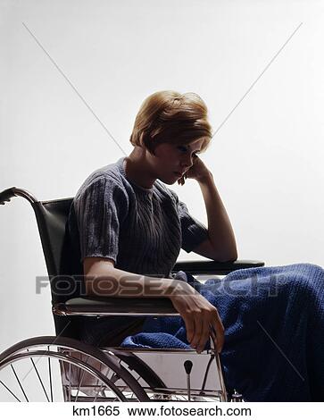1960s sad young woman sitting in wheelchair blanket wrapped around legs View Large Photo Image Stock Photography - 1960s sad young woman sitting in wheelchair blanket wrapped around legs. Fotosearch