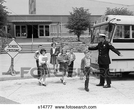 Stock Photo - 1960s school bus crossing guard children books. Fotosearch