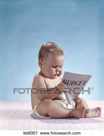 1960s serious baby reading budget View Large Photo Image Stock Photo - 1960s serious baby reading budget. Fotosearch