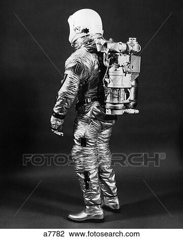 1960s side view of astronaut wearing helmet nasa space suit View Large Photo Image Stock Image - 1960s side view of astronaut wearing helmet nasa space suit. Fotosearch