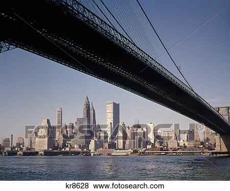1960s skyline view downtown manhattan taken from under the brooklyn bridge View Large Photo Image Stock Photo - 1960s skyline view downtown manhattan taken from under the brooklyn bridge. Fotosearch