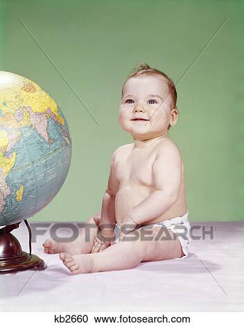 1960s smiling baby wearing diaper sitting beside earth globe View Large Photo Image Stock Image - 1960s smiling baby wearing diaper sitting beside earth globe. Fotosearch