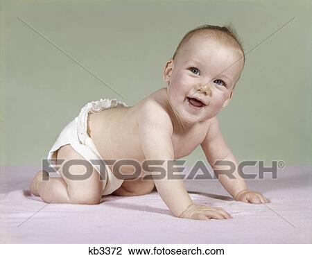 1960s smiling baby wearing diaper crawling on blanket View Large Photo Image Stock Image - 1960s smiling baby wearing diaper crawling on blanket. Fotosearch