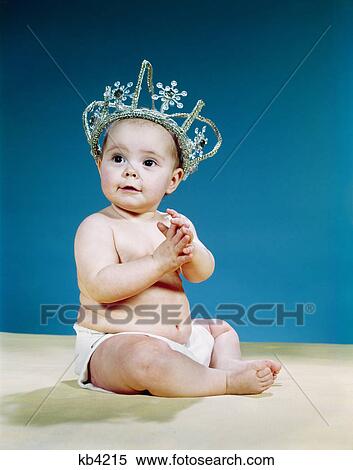 1960s smiling baby wearing rhinestone queens crown tiara princess View Large Photo Image Stock Photography - 1960s smiling baby wearing rhinestone queens crown tiara princess. Fotosearch