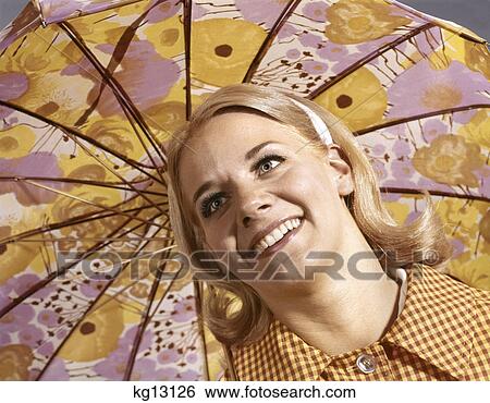 1960s smiling blond woman portrait head shoulders under umbrella View Large Photo Image Stock Photograph - 1960s smiling blond woman portrait head shoulders under umbrella. Fotosearch