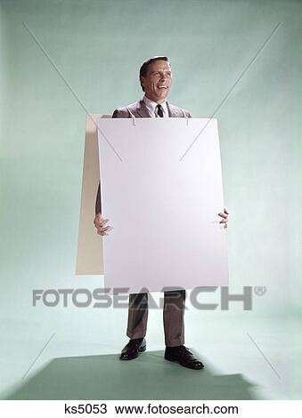 1960s smiling man wearing blank sandwich board full length View Large Photo Image Stock Image - 1960s smiling man wearing blank sandwich board full length. Fotosearch
