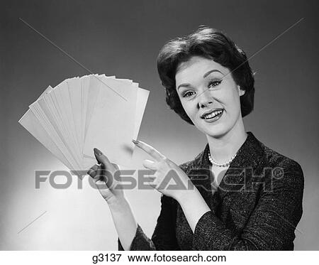1960s smiling woman holding fanned deck of blank index cards View Large Photo Image Stock Photo - 1960s smiling woman holding fanned deck of blank index cards. Fotosearch