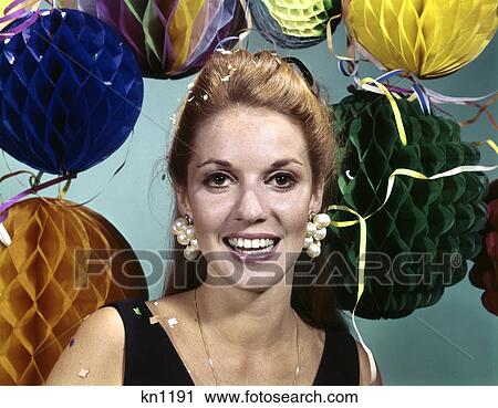 1960s smiling woman wearing big pearl earrings background of party decorations View Large Photo Image Stock Image - 1960s smiling woman wearing big pearl earrings background of party decorations. Fotosearch