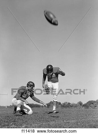 1960s team football place kick for field goal View Large Photo Image Stock Photo - 1960s team football place kick for field goal. Fotosearch