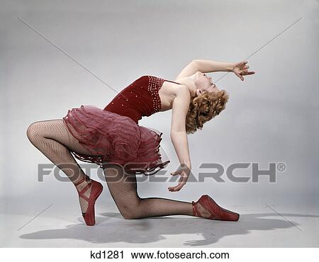 1960s teen girl layback position red velvet costume pink net tutu ballet attitude View Large Photo Image Stock Image - 1960s teen girl layback position red velvet costume pink net tutu ballet attitude. Fotosearch