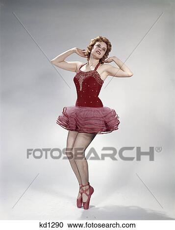 1960s teen girl woman red velvet costume pink net tutu fishnet stockings dance pose en pointe View Large Photo Image Stock Image - 1960s teen girl woman red velvet costume pink net tutu fishnet stockings dance pose en pointe. Fotosearch