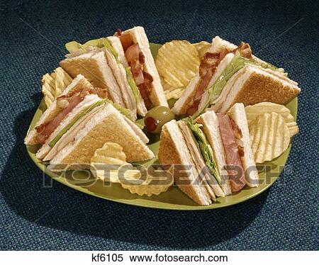 1960s toasted club sandwich turkey bacon lettuce tomato green plate View Large Photo Image Stock Photography - 1960s toasted club sandwich turkey bacon lettuce tomato green plate. Fotosearch