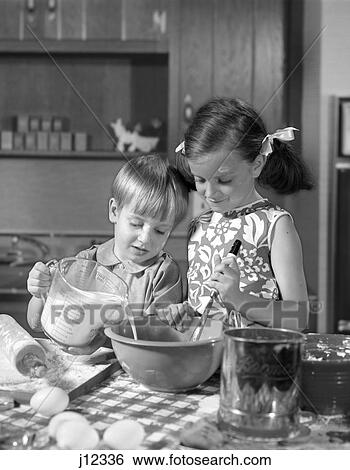 1960s two children mixing pouring baking in kitchen View Large Photo Image Stock Photograph - 1960s two children mixing pouring baking in kitchen. Fotosearch