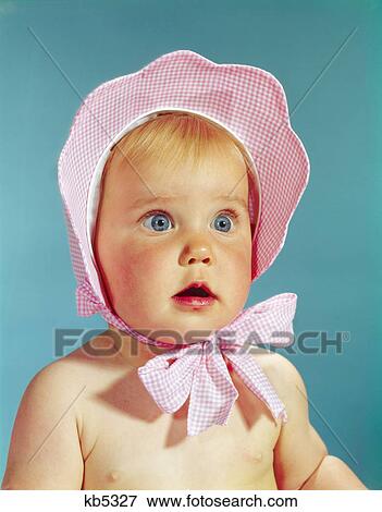 1960s very cute blond blue eyed baby wearing red white checked bonnet hat tied in bow at chin View Large Photo Image Stock Photo - 1960s very cute blond blue eyed baby wearing red white checked bonnet hat tied in bow at chin. Fotosearch