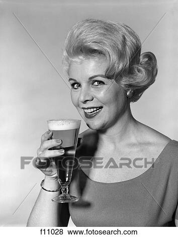 1960s woman beer glass smile View Large Photo Image Stock Photo - 1960s woman beer glass smile. Fotosearch