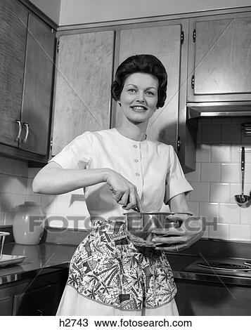 1960s woman kitchen housewife stir View Large Photo Image Stock Image - 1960s woman kitchen housewife stir. Fotosearch
