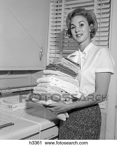 1960s woman laundry fold washer dryer View Large Photo Image Stock Image - 1960s woman laundry fold washer dryer. Fotosearch