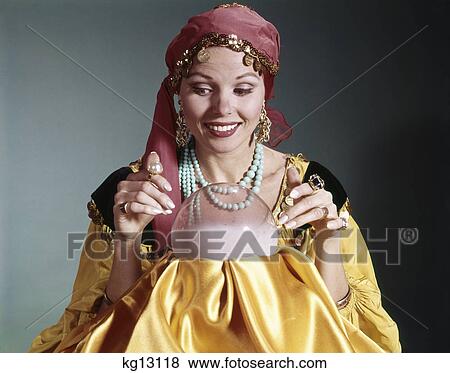 1960s woman portrait character crystal ball fortune teller costume View Large Photo Image Stock Photo - 1960s woman portrait character crystal ball fortune teller costume. Fotosearch