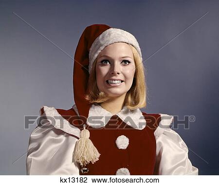 1960s woman wearing christmas santa helper costume View Large Photo Image Stock Image - 1960s woman wearing christmas santa helper costume. Fotosearch