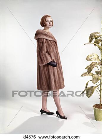 1960s woman wearing fur mink coat full length fashion View Large Photo Image Stock Photograph - 1960s woman wearing fur mink coat full length fashion. Fotosearch