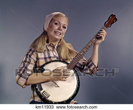 1960s young blond woman playing banjo wearing plaid shirt View Large Photo Image Stock Image - 1960s young blond woman playing banjo wearing plaid shirt. Fotosearch