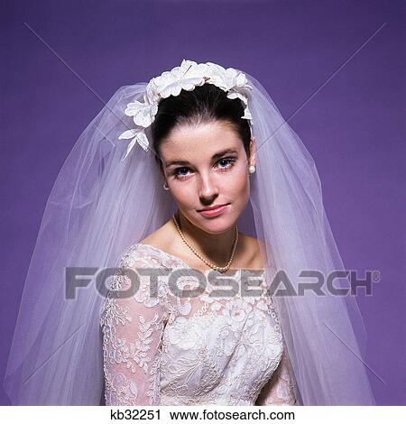 1960s young woman bride portrait bridal veil head shoulders smiling pearls View Large Photo Image Stock Image - 1960s young woman bride portrait bridal veil head shoulders smiling pearls. Fotosearch