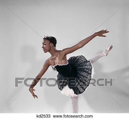 Stock Image - 1970s african american female ballet dancer wearing tutu. Fotosearch
