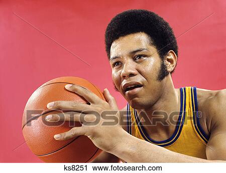 1970s african american man athlete basketball player with long sideburns about to pass ball View Large Photo Image Stock Image - 1970s african american man athlete basketball player with long sideburns about to pass ball. Fotosearch