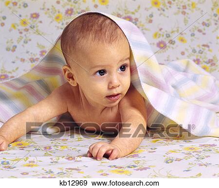 1970s baby crawling with blanket draped over head and shoulders View Large Photo Image Stock Photo - 1970s baby crawling with blanket draped over head and shoulders. Fotosearch
