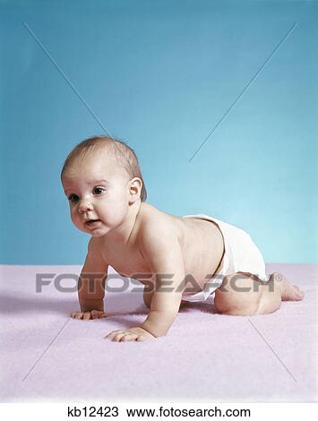 1970s baby wearing diaper crawling on pink blanket View Large Photo Image Stock Image - 1970s baby wearing diaper crawling on pink blanket. Fotosearch