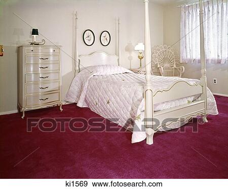 1970s bedroom with white four poster bed and dresser wicker chair and bright fuchsia carpeting View Large Photo Image Stock Photo - 1970s bedroom with white four poster bed and dresser wicker chair and bright fuchsia carpeting. Fotosearch