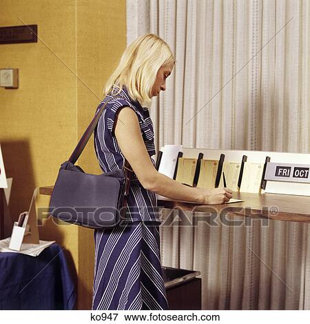 1970s blond woman writing a deposit slip at counter in bank View Large Photo Image Stock Photo - 1970s blond woman writing a deposit slip at counter in bank. Fotosearch