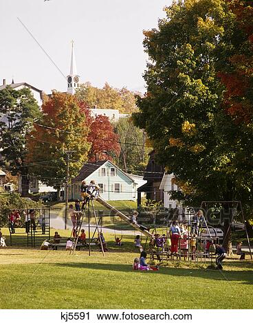 1970s children in small town public park playground in autumn barton vermont usa View Large Photo Image Stock Image - 1970s children in small town public park playground in autumn barton vermont usa. Fotosearch