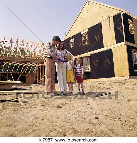 1970s family mother father boy girl new house construction site man woman kids couple View Large Photo Image Stock Photo - 1970s family mother father boy girl new house construction site man woman kids couple. Fotosearch