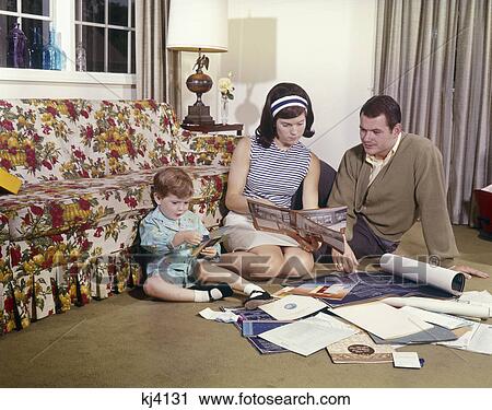 1970s family mother father daughter planning home View Large Photo Image Stock Image - 1970s family mother father daughter planning home. Fotosearch