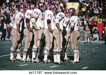 1970s harvard football team in huddle on field View Large Photo Image Stock Photo - 1970s harvard football team in huddle on field. Fotosearch