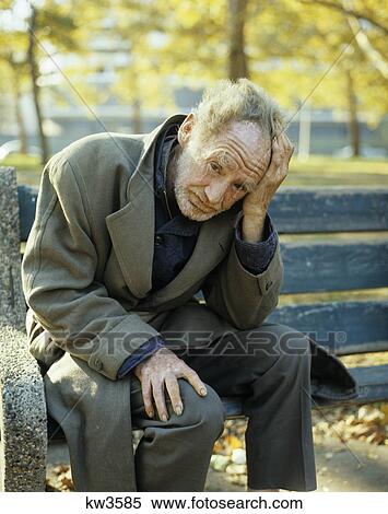 1970s homeless man elderly sitting on park bench View Large Photo Image Stock Photography - 1970s homeless man elderly sitting on park bench. Fotosearch