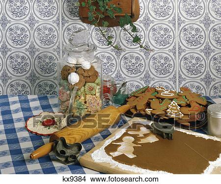 1970s kitchen still life of utensils used to make gingerbread men View Large Photo Image Picture - 1970s kitchen still life of utensils used to make gingerbread men. Fotosearch