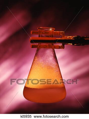 1970s laboratory still life of metal support holding flask filled with red sudsy liquid View Large Photo Image Stock Photography - 1970s laboratory still life of metal support holding flask filled with red sudsy liquid. Fotosearch