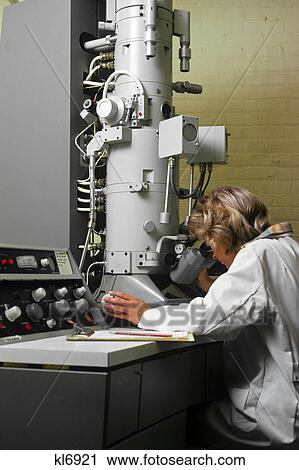 1970s laboratory woman technician using electron microscope View Large Photo Image Stock Image - 1970s laboratory woman technician using electron microscope. Fotosearch