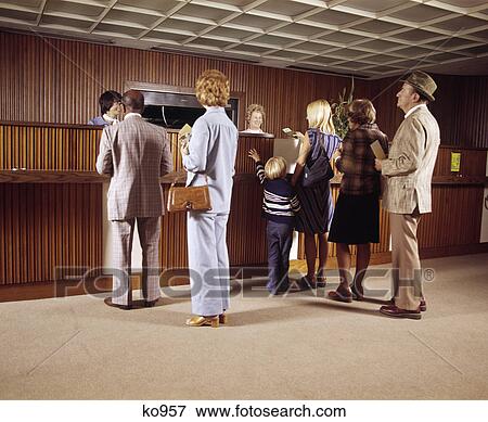 1970s line of men women children waiting for bank teller View Large Photo Image Stock Photo - 1970s line of men women children waiting for bank teller. Fotosearch