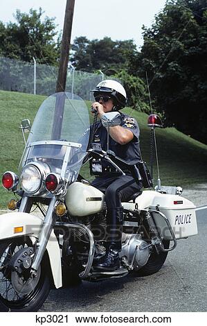 1970s motorcycle police officer talking on hand held radio View Large Photo Image Stock Image - 1970s motorcycle police officer talking on hand held radio. Fotosearch
