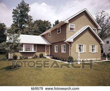 1970s mustard green house with double peaked roof and bay window View Large Photo Image Stock Photo - 1970s mustard green house with double peaked roof and bay window. Fotosearch