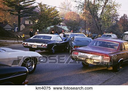 Stock Photography - 1970s police at scene of automobile accident collision. Fotosearch