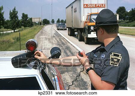 1970s police officer man operating radar equipment roadside check for speeding traffic View Large Photo Image Stock Image - 1970s police officer man operating radar equipment roadside check for speeding traffic. Fotosearch