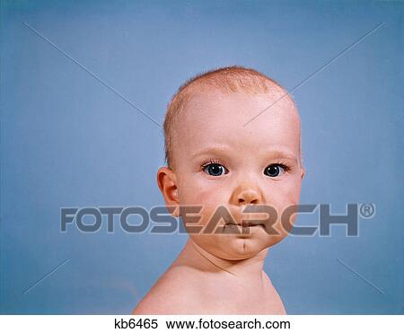 1970s portrait baby blue background pursed lips facial expression View Large Photo Image Stock Photography - 1970s portrait baby blue background pursed lips facial expression. Fotosearch