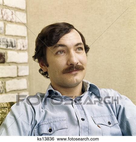 1970s portrait man with brown hair moustache wearing denim shirt View Large Photo Image Stock Photograph - 1970s portrait man with brown hair moustache wearing denim shirt. Fotosearch
