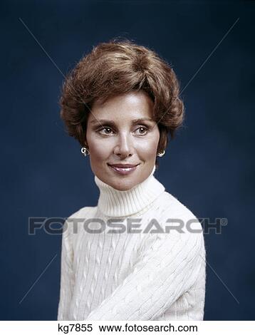 1970s portrait of smiling woman wearing cable knit turtleneck sweater silver earrings fashion View Large Photo Image Stock Photography - 1970s portrait of smiling woman wearing cable knit turtleneck sweater silver earrings fashion. Fotosearch